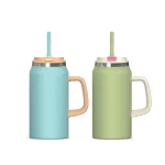 Oversized travel tumbler with grip handle and straw
